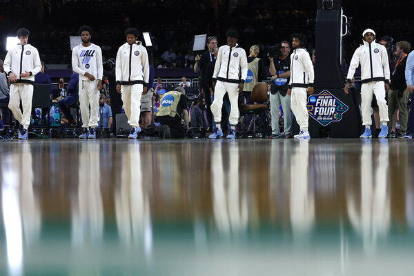 North Carolina players warm up on the court before the game.
