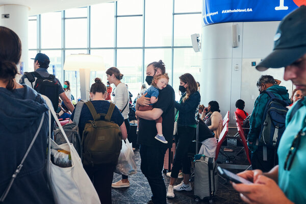 Travelers at La Guardia Airport in New York on Saturday.