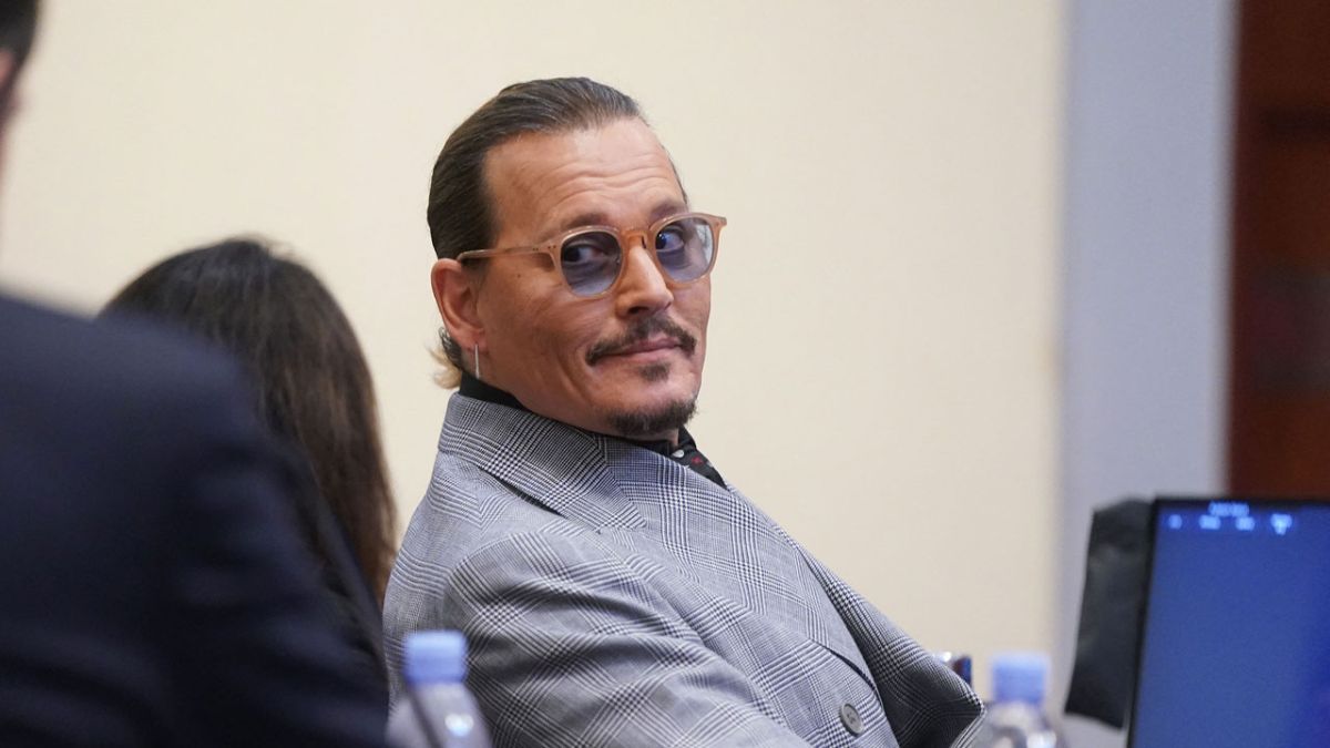 Johnny Depp looking amused in court.