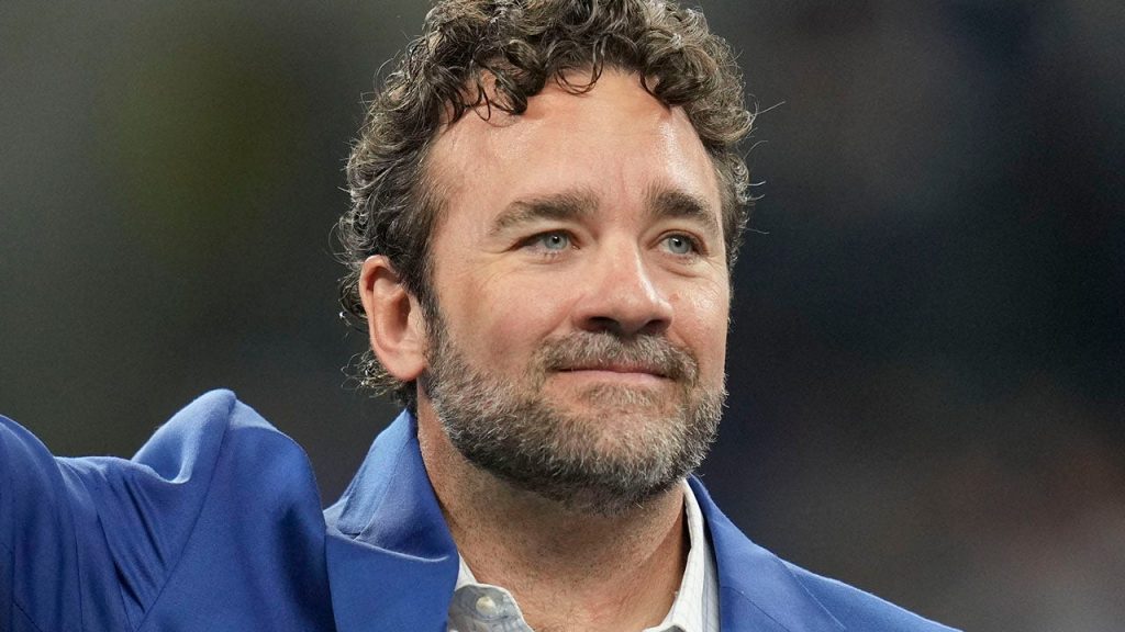 Former Indianapolis Colts player Jeff Saturday waves to the crowd during a Ring of Honor induction ceremony for Tarik Glenn on Sunday, Oct. 30, 2022, during a game against the Washington Commanders at Indianapolis Colts at Lucas Oil Stadium in Indianapolis.